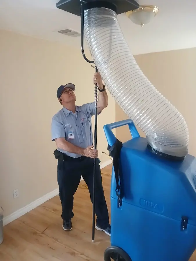 Furnace Tune-Up technician using HEPA equipment in Zephyrhills West